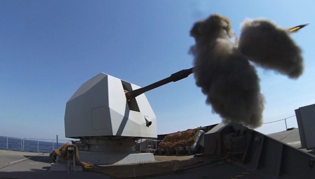 HMS DEFENDER fires her 4.5 inch Mk 8 Mod 1 naval gun