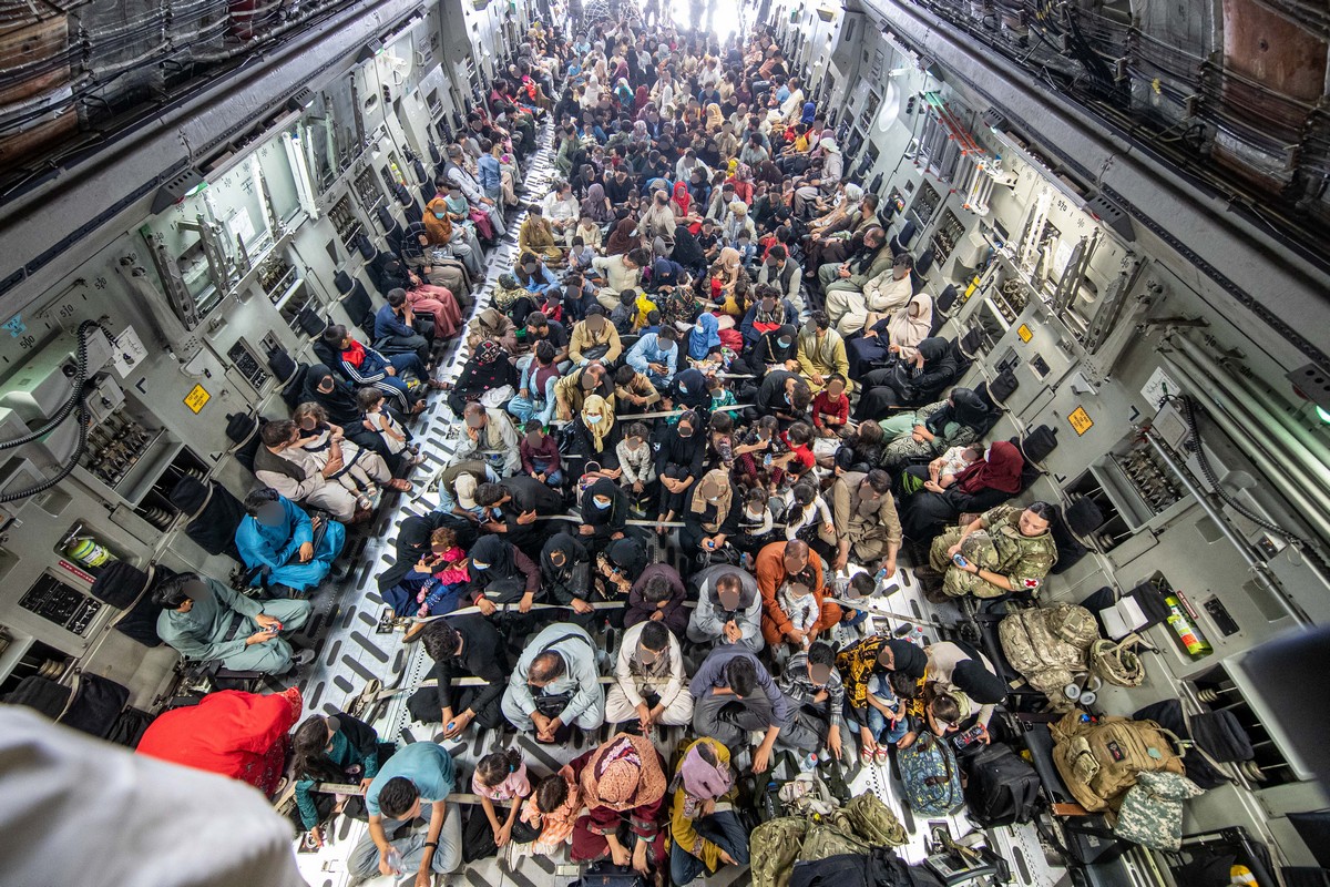 A flight of 265 people boarding an RAF C17 for evacuation