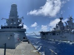 British warships takes on fuel from American assault ship