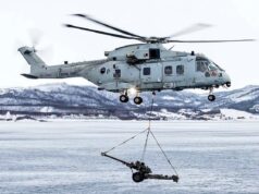 Video shows helicopter move artillery guns ashore