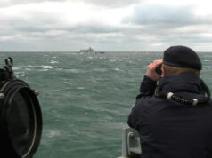 British frigate keeps watch on Russian warship