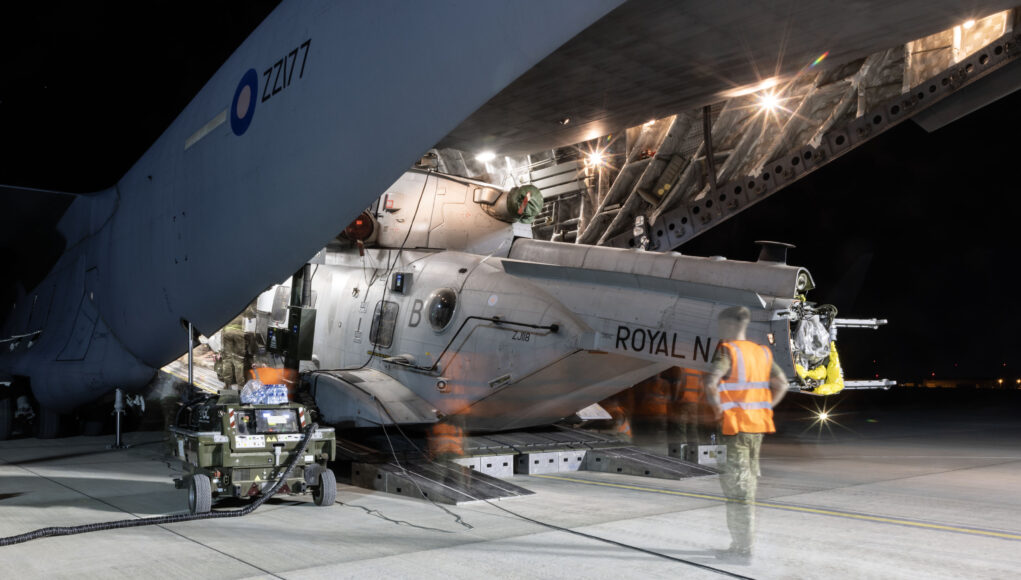 A Royal Air Force aircraft carrier has transported a Royal Navy helicopter and some of its crew from across the other side of the world back to the UK just in time for Christmas.