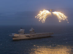 Flares light up British aircraft carrier