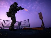 Royal Marines undertake weapons training on warship