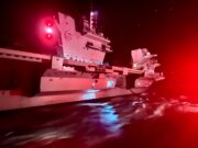 Stunning image shows carrier being refuelled at night
