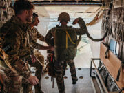 French paratroopers land on British soil as President visits