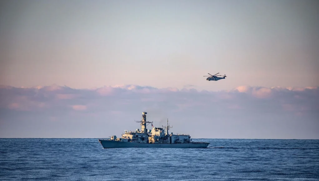 HMS Somersets Merlin makes a pass of the ship during Ex Arctic Dolphin