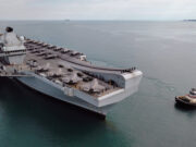 Drone shows British aircraft carrier arrive in Australia