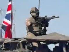 British armoured vehicles roll through Polish capital