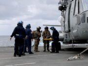 British destroyer evacutes mock casualty to carrier