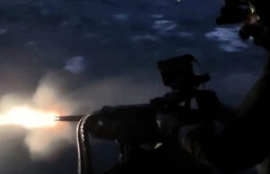 Merlin from HMS St Albans opens fire at night in drills