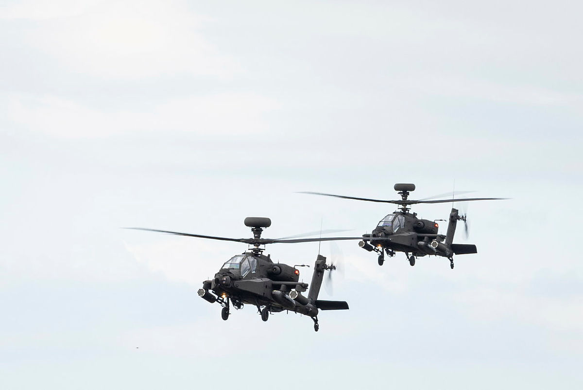 Apache attack helicopters fly up River Clyde in Glasgow