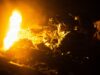 US, Philippine armies open Salaknib 2026 exercise Soldier in night-vision gear firing a rifle beside a large orange flame at night