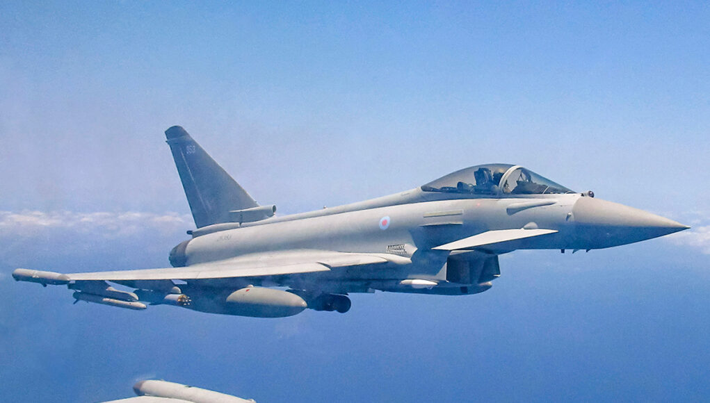 JCCU(ME)-20260428-0133-APKWS A2A Self Take-014-Crop Royal Air Force Eurofighter Typhoon in flight over the sea, with underwing weapons and drop tanks visible.
