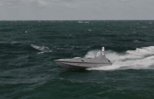 Beehive may be another Dreadnought moment Gray speedboat racing across choppy dark green ocean with white spray at the stern, under a cloudy sky.