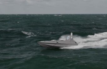 Beehive may be another Dreadnought moment Gray speedboat racing across choppy dark green ocean with white spray at the stern, under a cloudy sky.