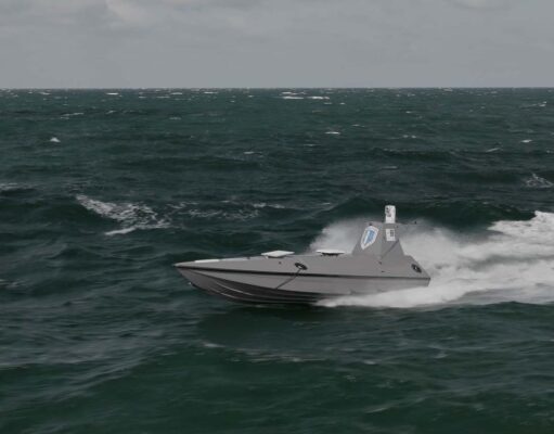 Gray speedboat racing across choppy dark green ocean with white spray at the stern, under a cloudy sky.