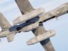 MQ-9B drone gets airborne early warning capability Military unmanned drone in flight with its open payload bay visible.