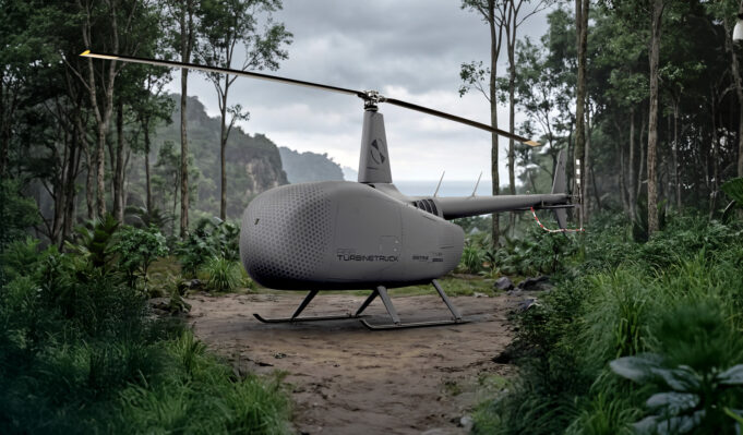 Grey autonomous helicopter drone with a two-bladed rotor on a forest path, rugged landing skids, surrounded by dense jungle.
