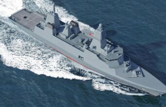 Modern gray destroyer cruising through open sea, bow to the right, leaving a frothy wake behind.