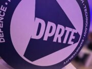 DPRTE Scotland delivers an astounding first edition Close-up of a round sign featuring the DPRTE logo at an event or expo setting.