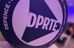 DPRTE Scotland delivers an astounding first edition Close-up of a round sign featuring the DPRTE logo at an event or expo setting.