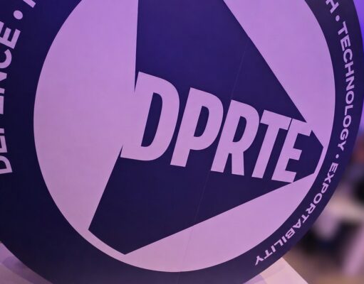 DPRTE Scotland delivers an astounding first edition Close-up of a round sign featuring the DPRTE logo at an event or expo setting.
