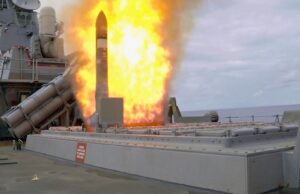 Royal Navy long-range sub-hunting missile still in concept phase Missile launches from a naval ship's launcher with a large orange flame plume surrounding the rocket.