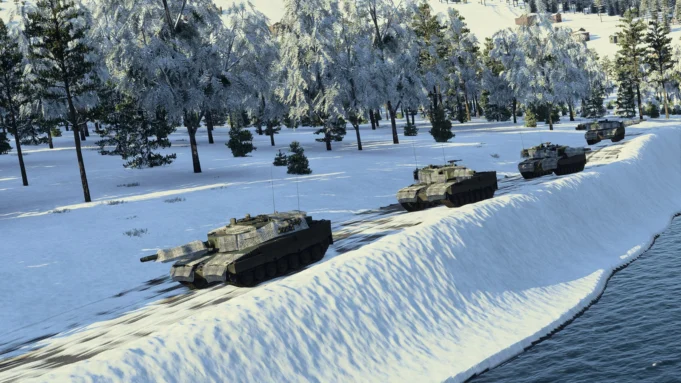 Line of armored tanks driving along a snow-covered riverbank with a forest of frosted trees in the background