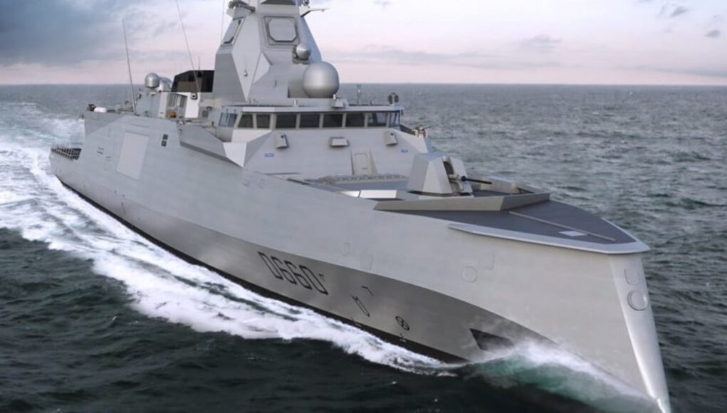 public (1) Gray stealth destroyer sailing at sea, angular superstructure cutting through white water.