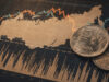 Russian ruble coins placed on a stock market chart showing fluctuating lines and data.