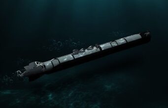 Torpedo submerged in dark ocean water, trailing bubbles as it drifts forward.