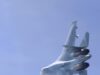 Russian jet dangerously close to British military aircraft Blurred fighter jet ascending into a clear blue sky, twin vertical tails visible at the rear.