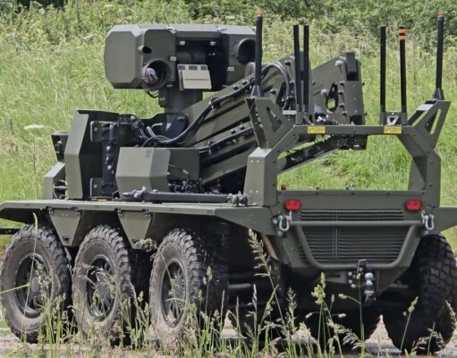 British-built brain lets UGVs navigate when GPS goes down Eight-wheeled armored unmanned ground vehicle with a mounted sensor turret on a grassy field.
