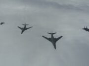 American bombers ‘ready to strike’ over the North Sea Six military aircraft flying in a loose formation across a cloudy sky.
