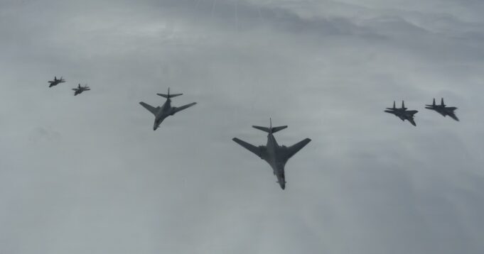 American bombers ‘ready to strike’ over the North Sea Six military aircraft flying in a loose formation across a cloudy sky.