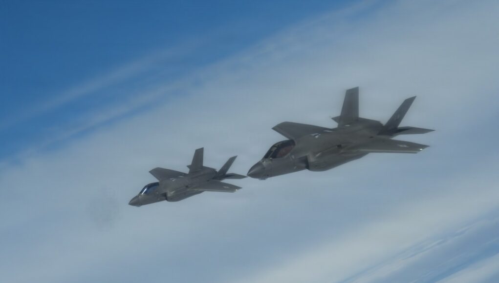 Astral Knight 26: F-15E F-35A B-1B Operations Two gray fighter jets flying in formation across a blue sky.