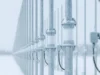 Australia exports over-the-horizon radar to Canada Row of snow-dusted streetlight posts along a railing in a snowy landscape, receding into the distance.