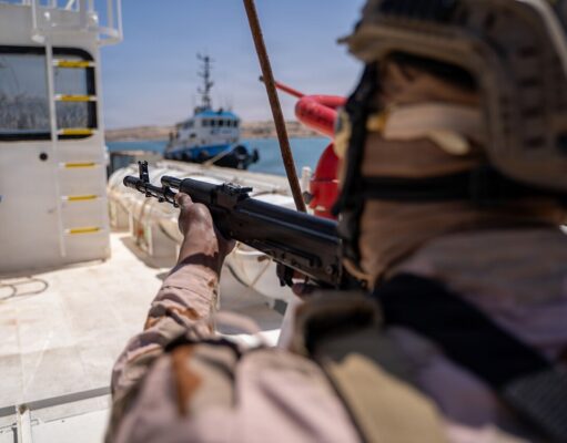 Briton guilty of brokering jets and missiles to war zones Soldier in camouflage aiming a rifle from the deck of a ship, with a small patrol boat visible in the water in the background.