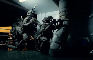 3 Commando Brigade renamed the UK Commando Force Special forces operators in full tactical gear crouch and aim rifles in a dim corridor of a vessel or building.