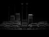 CSG unveils Trident layered air defence at Eurosatory Row of large trucks with tall antenna masts silhouetted against a dark background, forming a straight line.