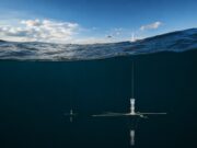 Ultra Maritime trials next-gen sub-hunting sonobuoy in UK Underwater research mooring: a vertical instrument with cross-shaped sensor hanging from a line beneath the surface of dark blue water.