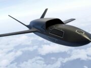 Airbus unveils Ravenstorm combat drone A sleek, black concept aircraft gliding above a cloudy sky with long, slender wings.