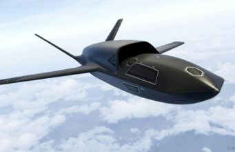 Airbus unveils Ravenstorm combat drone A sleek, black concept aircraft gliding above a cloudy sky with long, slender wings.