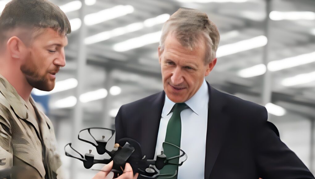 enhanced (1) Military personnel in camouflage hands a tactical vest to a businessman in a suit inside a hangar, as they converse.