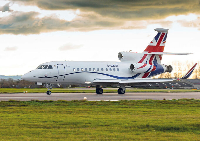 Britain pauses plan to militarise VIP transport jets White business jet with Union Jack tail taxiing on a runway under a cloudy sky