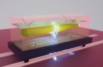QinetiQ boosts UK mine-hunting drone testing at Portland Abstract yellow sculpture under a glass cover on a dark pedestal in a gallery.