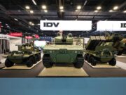Leonardo’s IDV unveils uncrewed light tank at Eurosatory Military tanks on display at an exhibition hall with bright overhead lighting and large IDV signs in the background.