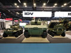 Leonardo’s IDV unveils uncrewed light tank at Eurosatory Military tanks on display at an exhibition hall with bright overhead lighting and large IDV signs in the background.