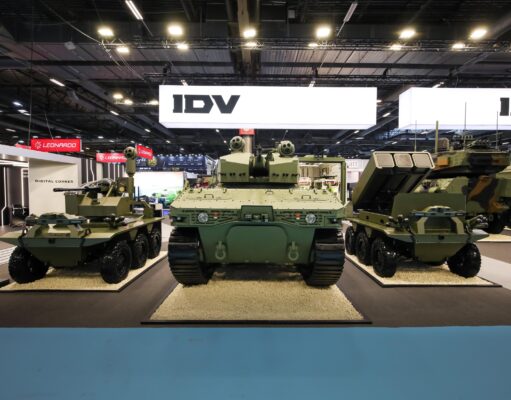 Leonardo’s IDV unveils uncrewed light tank at Eurosatory Military tanks on display at an exhibition hall with bright overhead lighting and large IDV signs in the background.